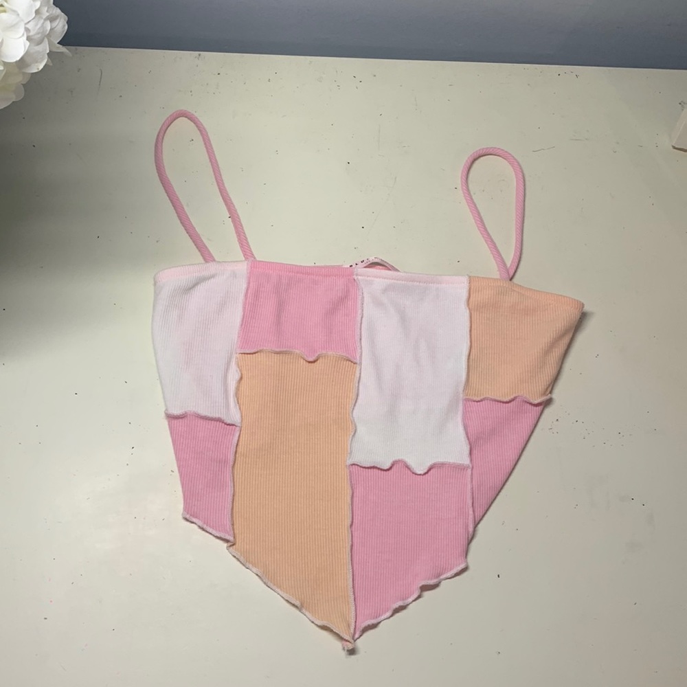 pink, orange, and white bandana top.